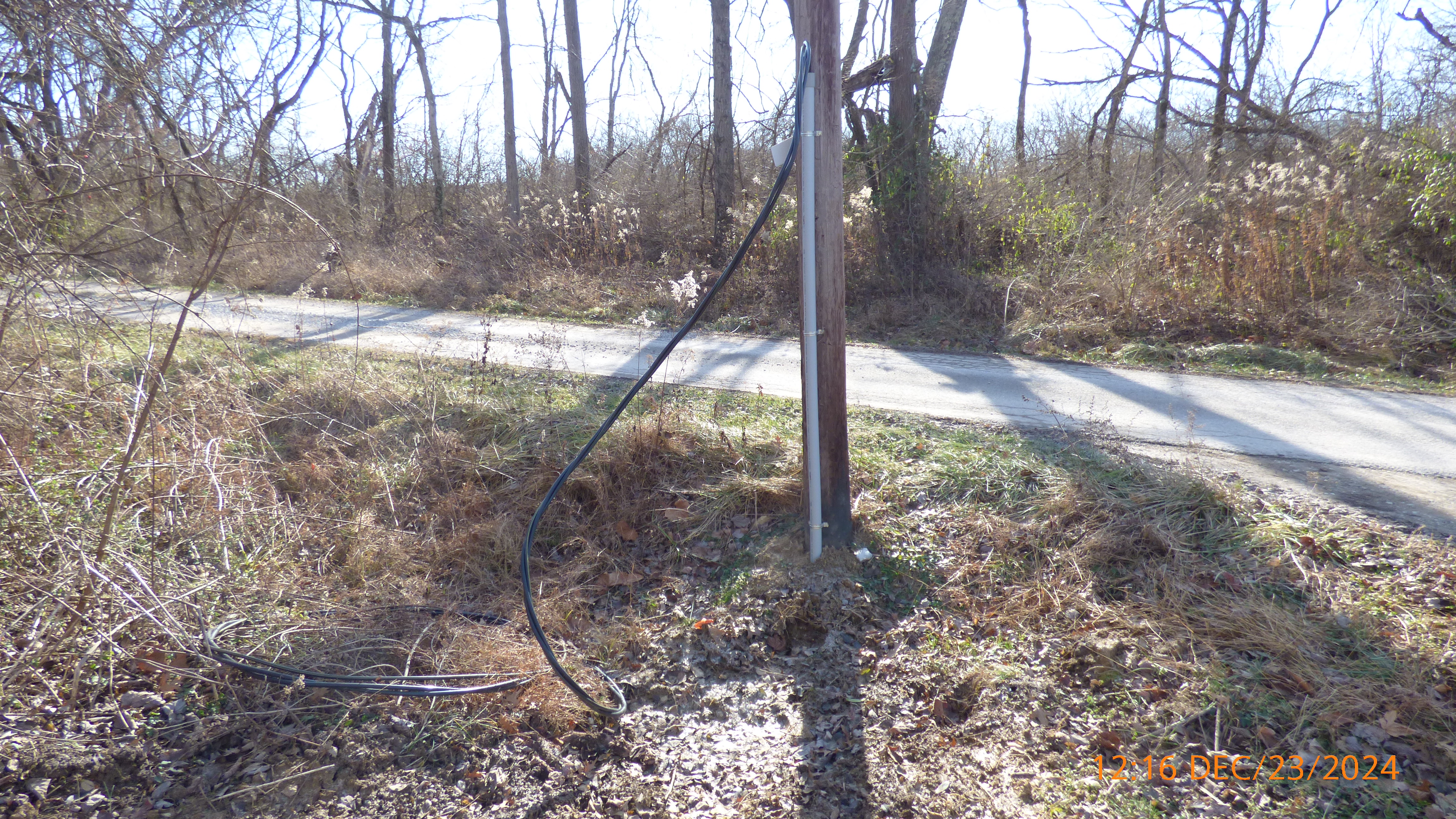 INSTALLATION OF SERVICE WIRE IN PVC PIPE TO DUKE ENERGY.